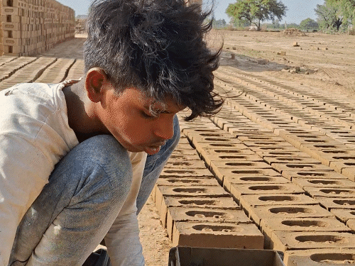 In the scorching afternoon, when people are confined to their homes, workers at brick kilns are busy arranging for two meals a day.