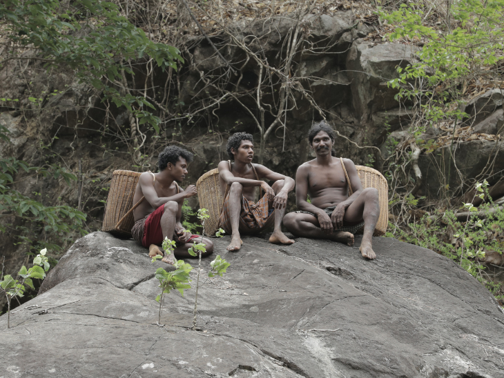 Some Cholanaikkan men sitting on a rock. The forest is their life. Photo- KA Shahji