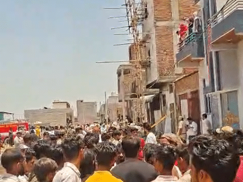 After the fire, a huge crowd gathered outside the warehouse.