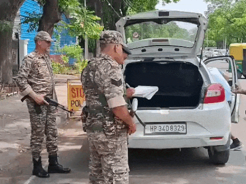 Security has been increased in the area. Here CRPF personnel are cooperating with the police in searching the vehicles.