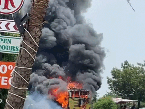 A massive fire breaks out in the bus after it is pulled over to the roadside.