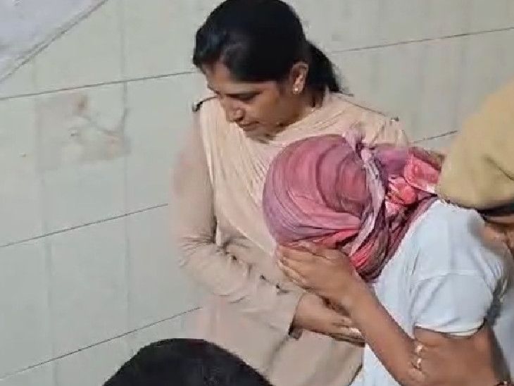 After appearing in court, the student came out hiding her face with her hands.