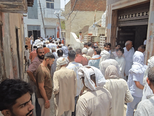 People going to perform Bhavishya's last rites in Mahipur village on Tuesday.