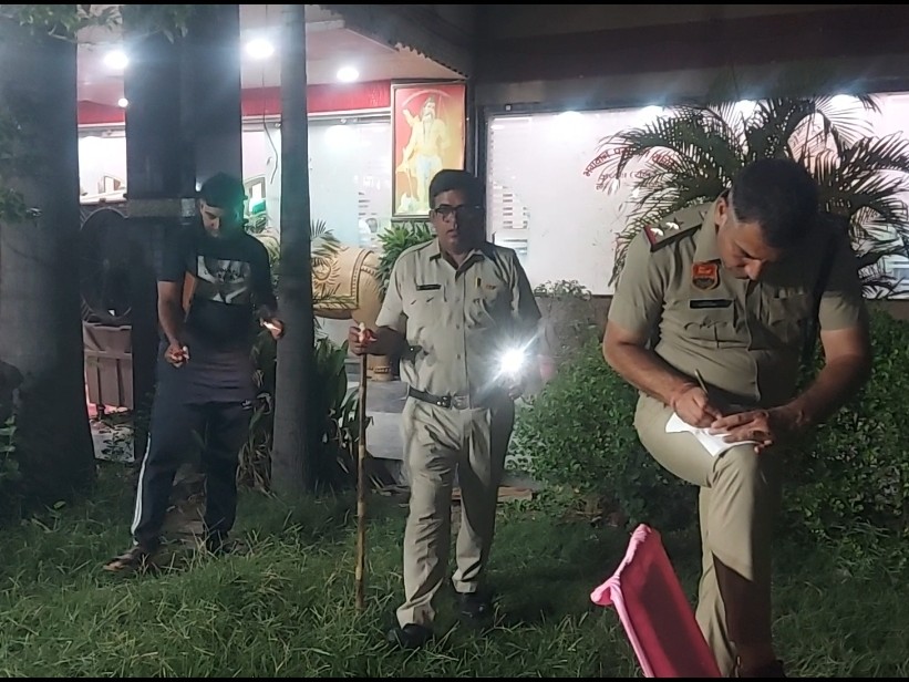Police conducting an investigation at Parshuram Bhavan in Sampla.