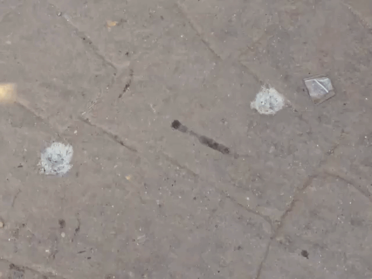 When the carbine fell, two rounds were fired. The bullets directly hit the road, causing a small pit on the road.