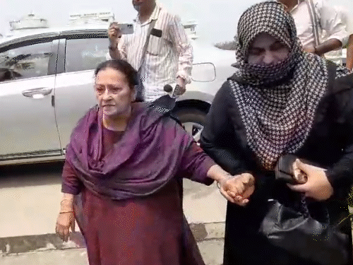 Azam Khan's wife, Tanzin Fatima, was escorted by SP leaders to her office on the university campus.