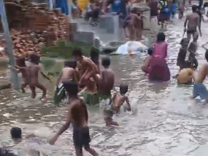 Rainwater flooded the roads in Khagaria, Bihar, where children were seen playing.