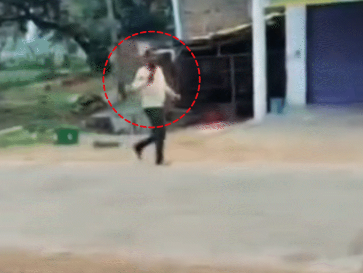 Is seen leaving with a country-made pistol after the assault.