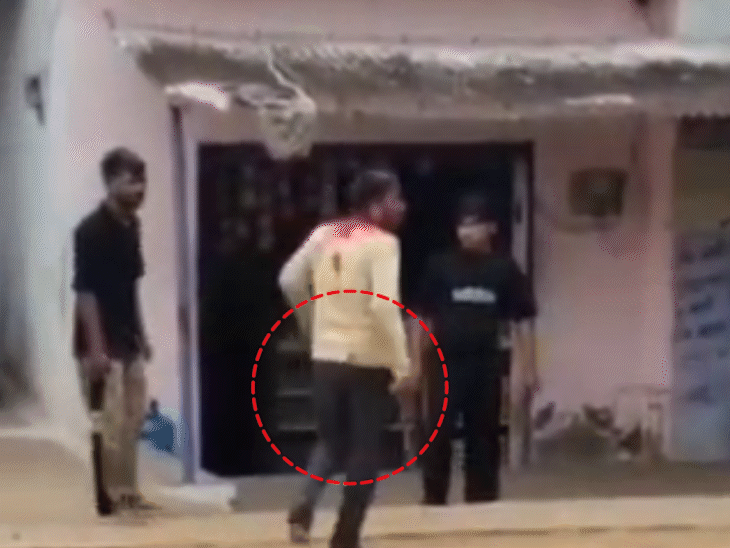 Is seen loading the country-made pistol before firing.