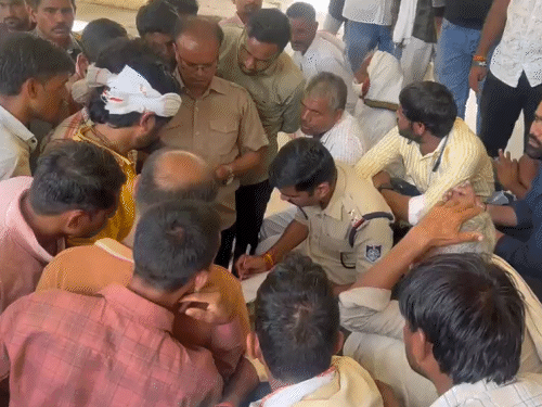 Police taking statements from villagers after the incident.