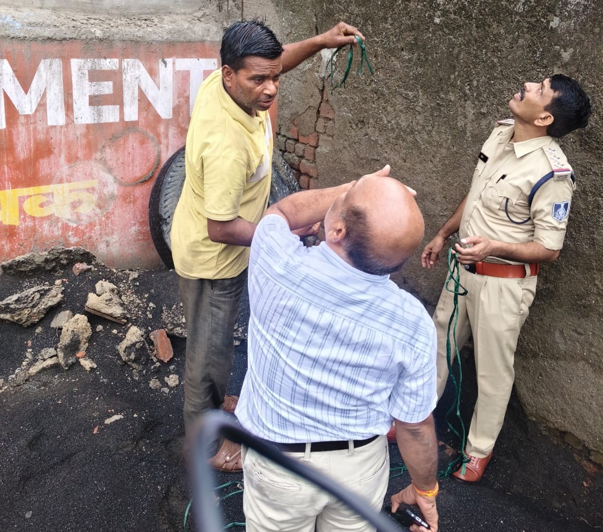 Police station in-charge and FSL officer investigating at the crime scene.
