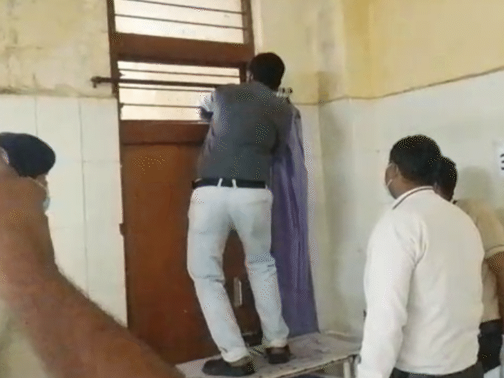 Employees trying to look into the store room after a foul smell was detected