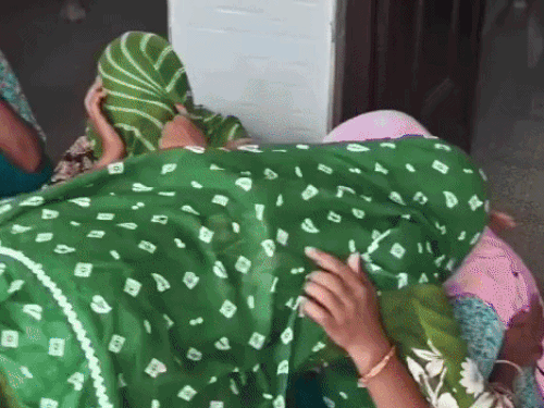 Women in the family crying at home.
