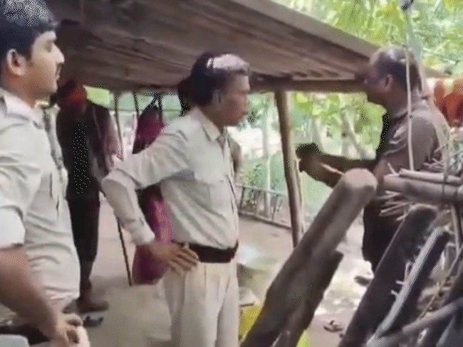 The team arrived on a complaint of illegal liquor. An argument ensued with the Sarpanch representative here.