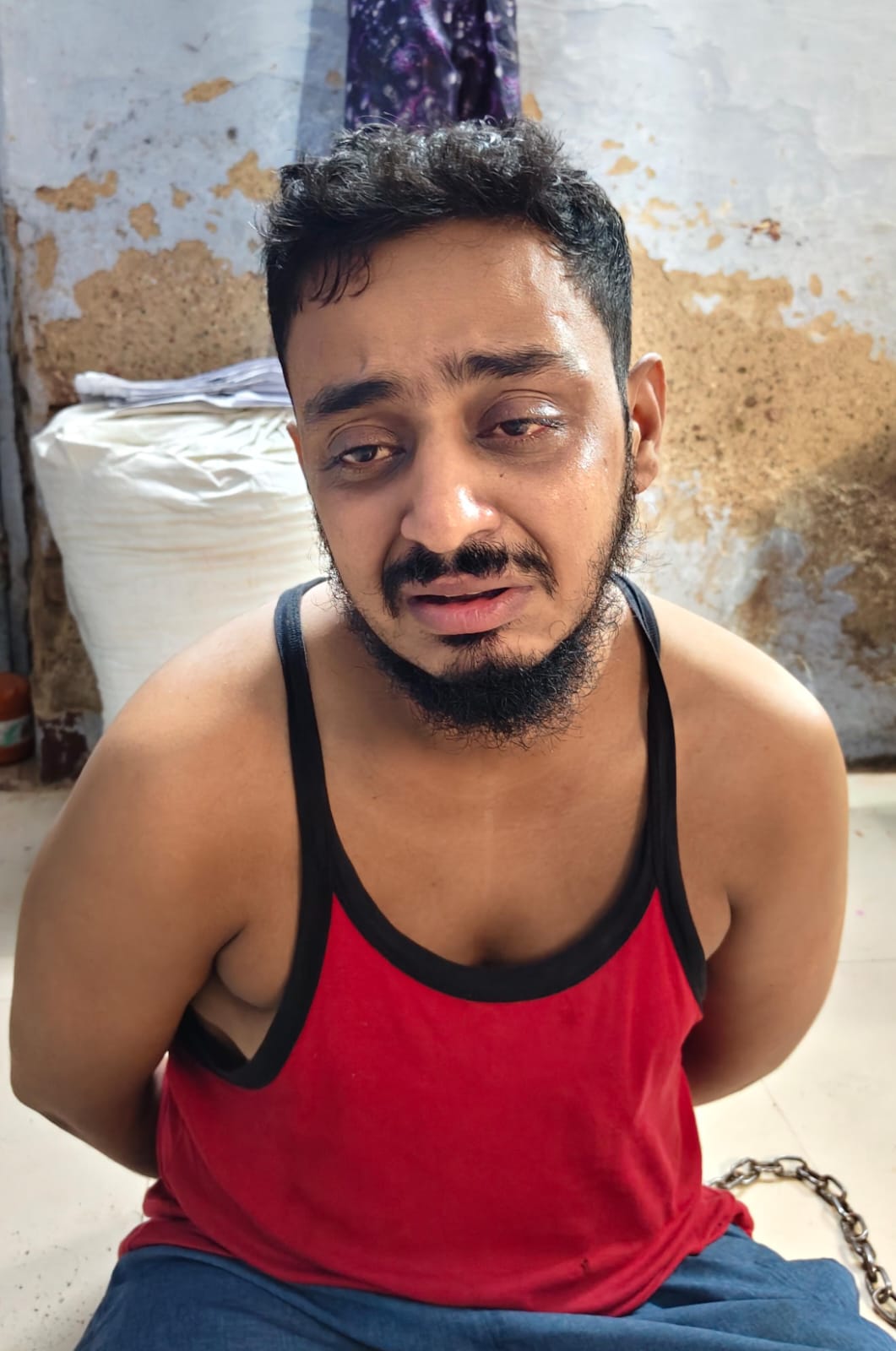Accused husband Asgar Ali in police custody at the police station