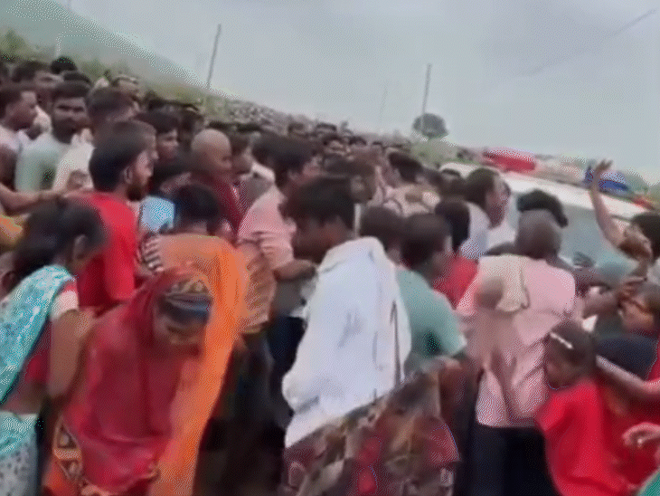 Villagers separating women from policemen.