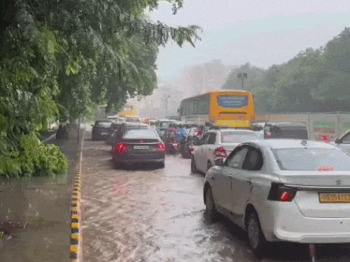 Long traffic jams at several places in Gurugram, Haryana due to waterlogging on roads.