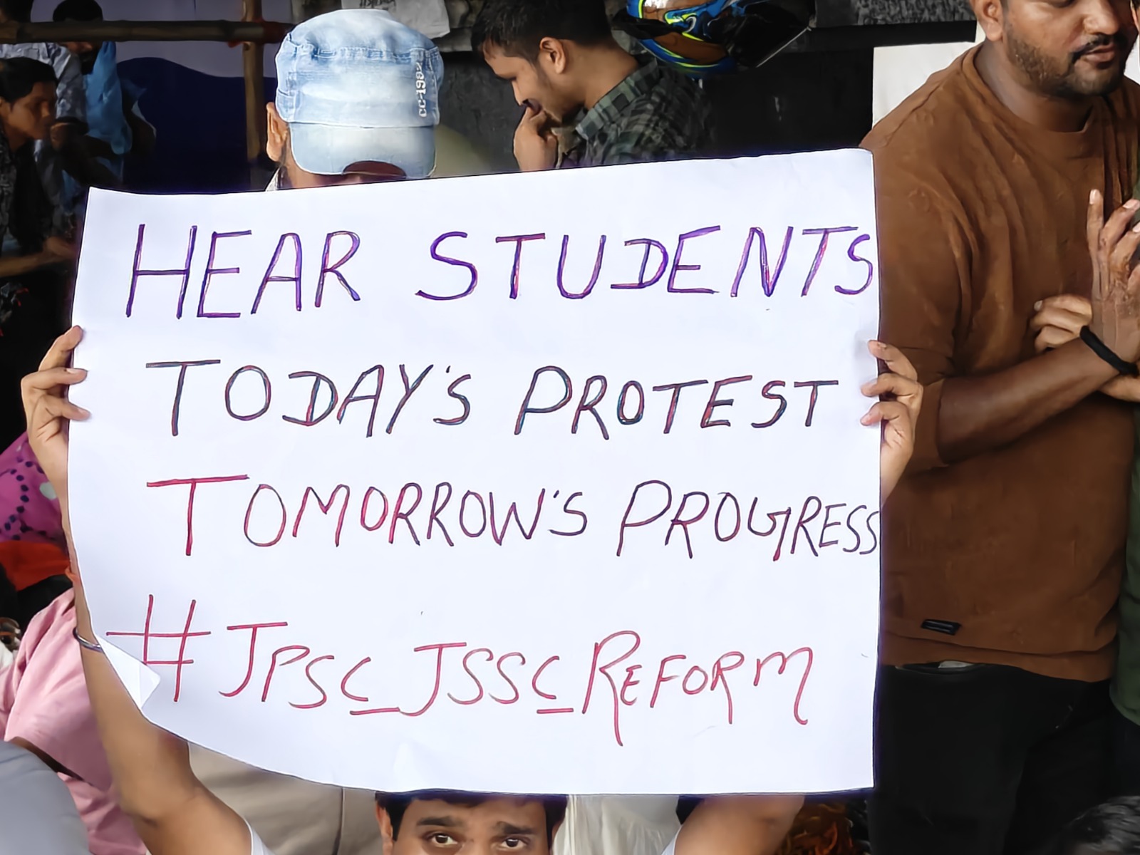 During the protest, students were holding various types of posters in their hands.