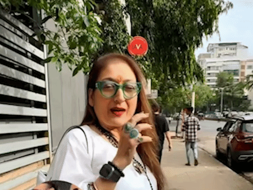 Sunita Ahuja talking to the paparazzi.