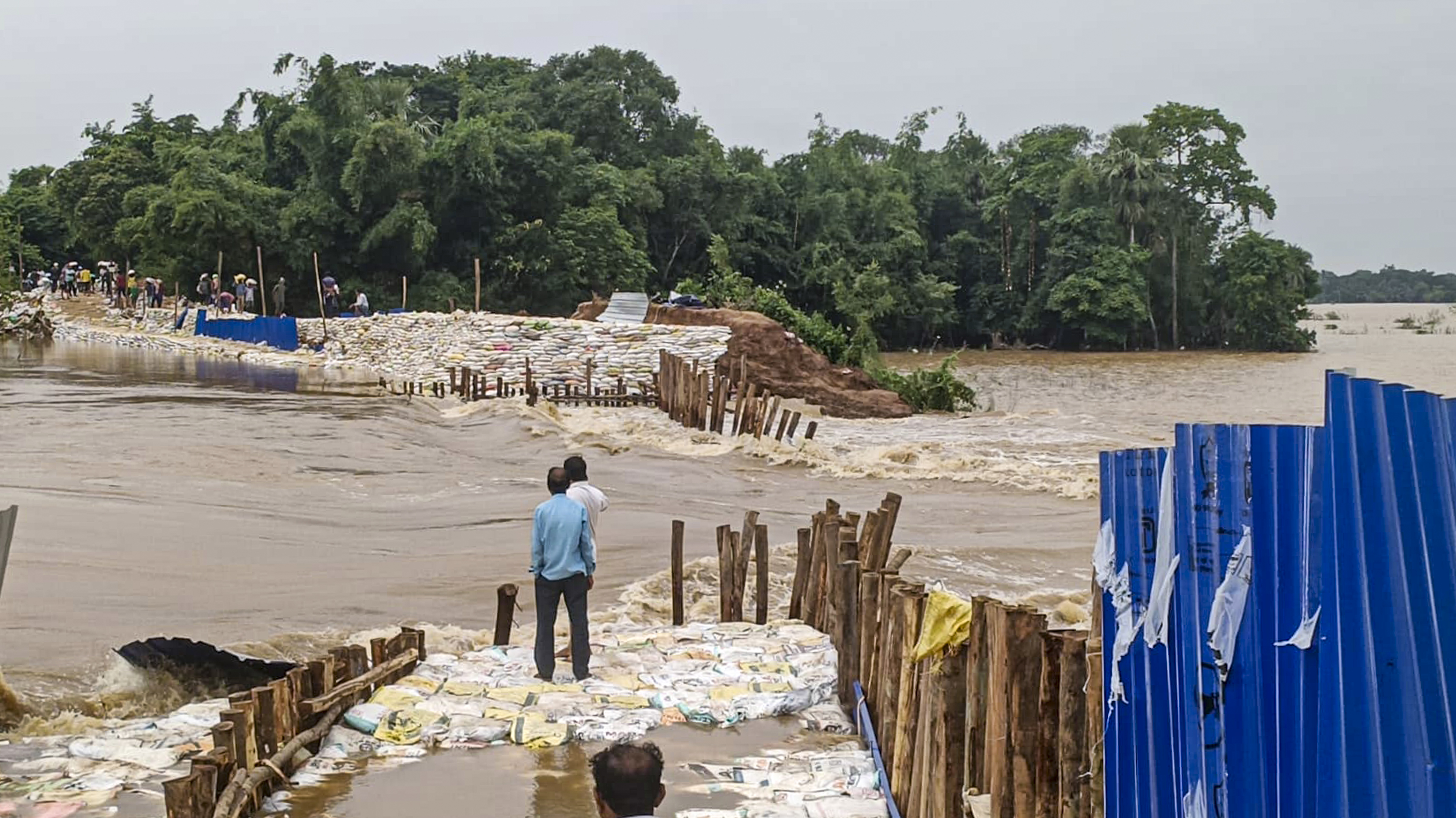 A bridge under construction on the Kani River, a tributary of the Baitarani River, was washed away due to sudden floods in Dasarathpur block.