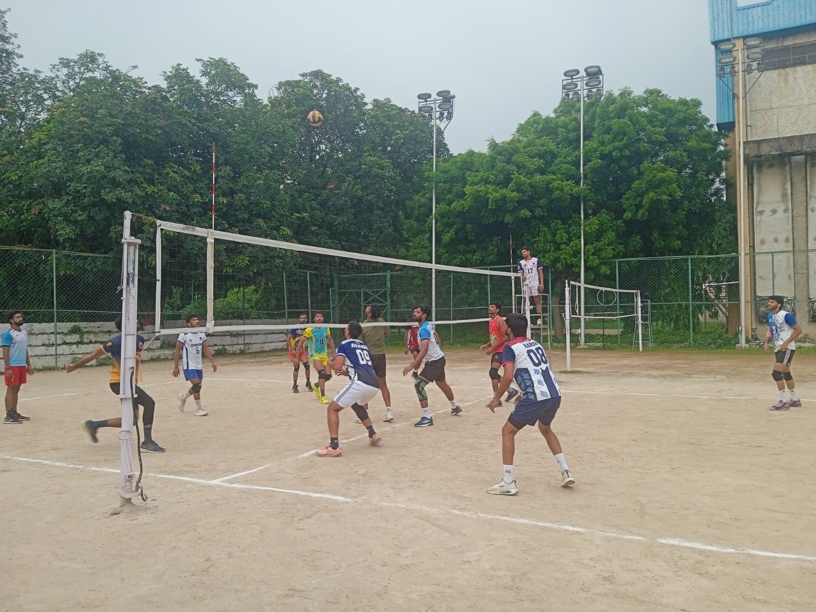 Young players playing volleyball.
