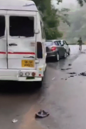 After the elephant attack, the car's wreckage was seen scattered on the road.