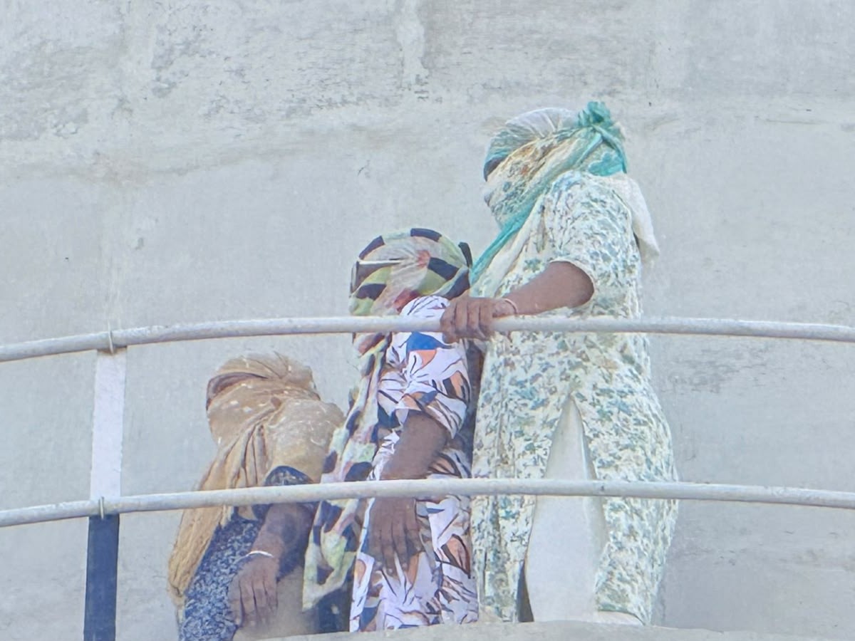 Women climbed on water tank frustrated by no action on complaint