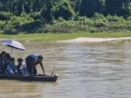 In Jonai, Assam, a bridge was broken in the river flood on June 28. Due to this, children now have to cross the river by boat to go to school