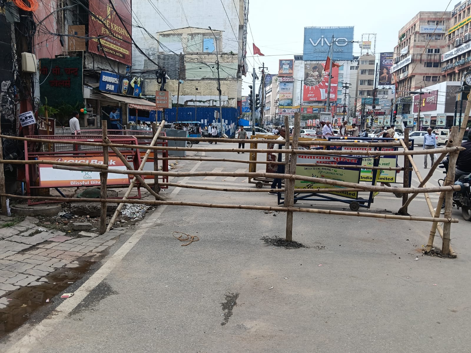 For the first time, bamboo barricading has been done in the middle of the road at Dakbungla Chowk.