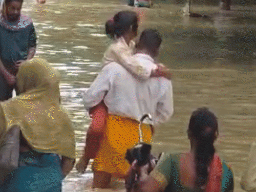 The pictures are from BHU Hospital in Varanasi. After the rain, people were seen carrying patients on their shoulders through knee-deep water.