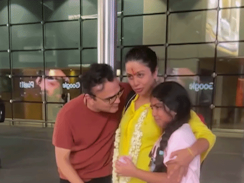 She appeared emotional while hugging her husband and daughter at Mumbai airport.