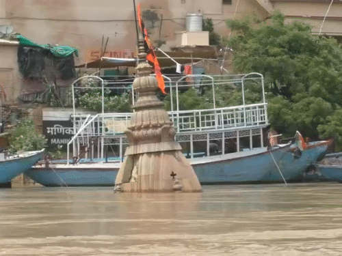 The Ratneshwar Mahadev Temple in Kashi, Uttar Pradesh, has been submerged. Only part of the dome is visible.