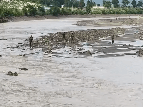 Army soldiers searching after the water level in the Western Yamuna Canal dropped.