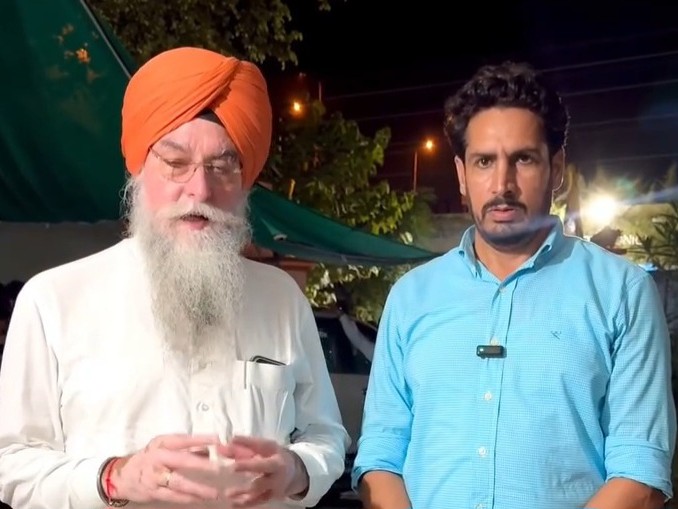 Sarpanch Jagtar Singh Khara talking to Speaker Kultar Singh Sandhwan.