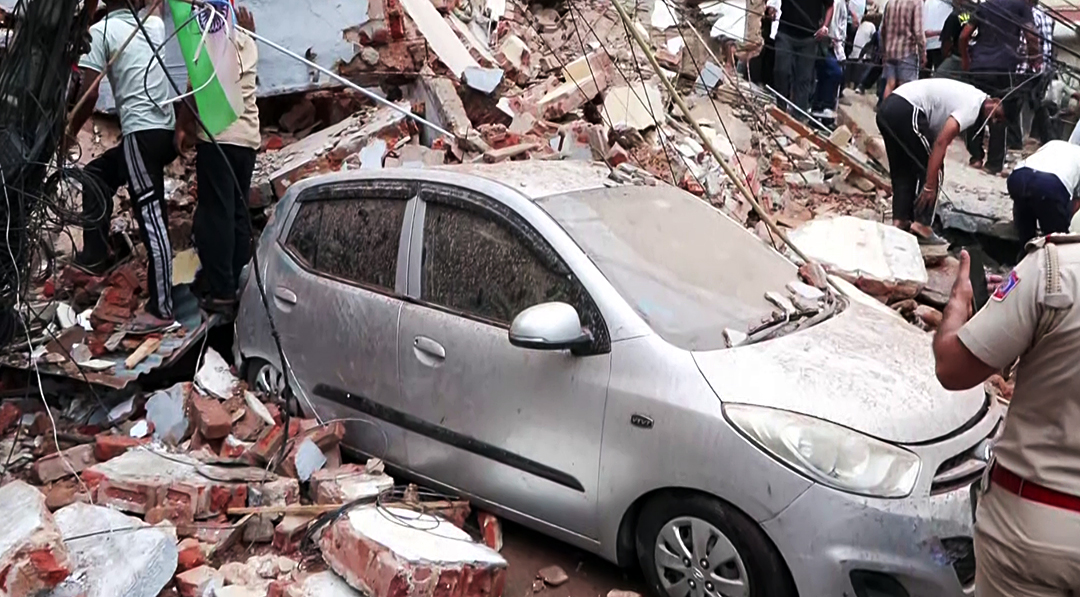 Several cars and other vehicles were buried under the debris of the building. The cars were severely damaged.