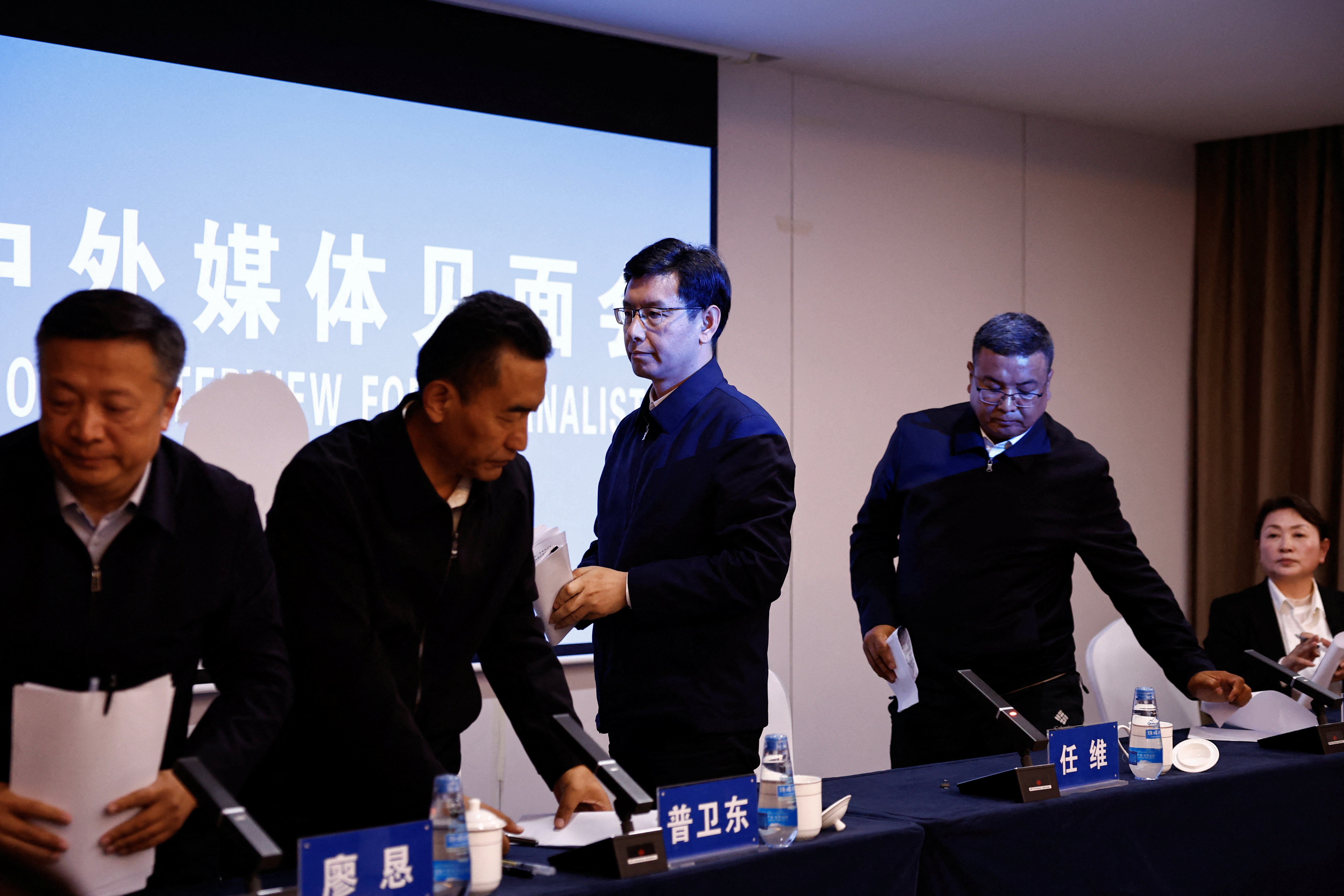 Chinese officials giving information about the devastation caused by floods and debris at Gyirong Port in Tibet.