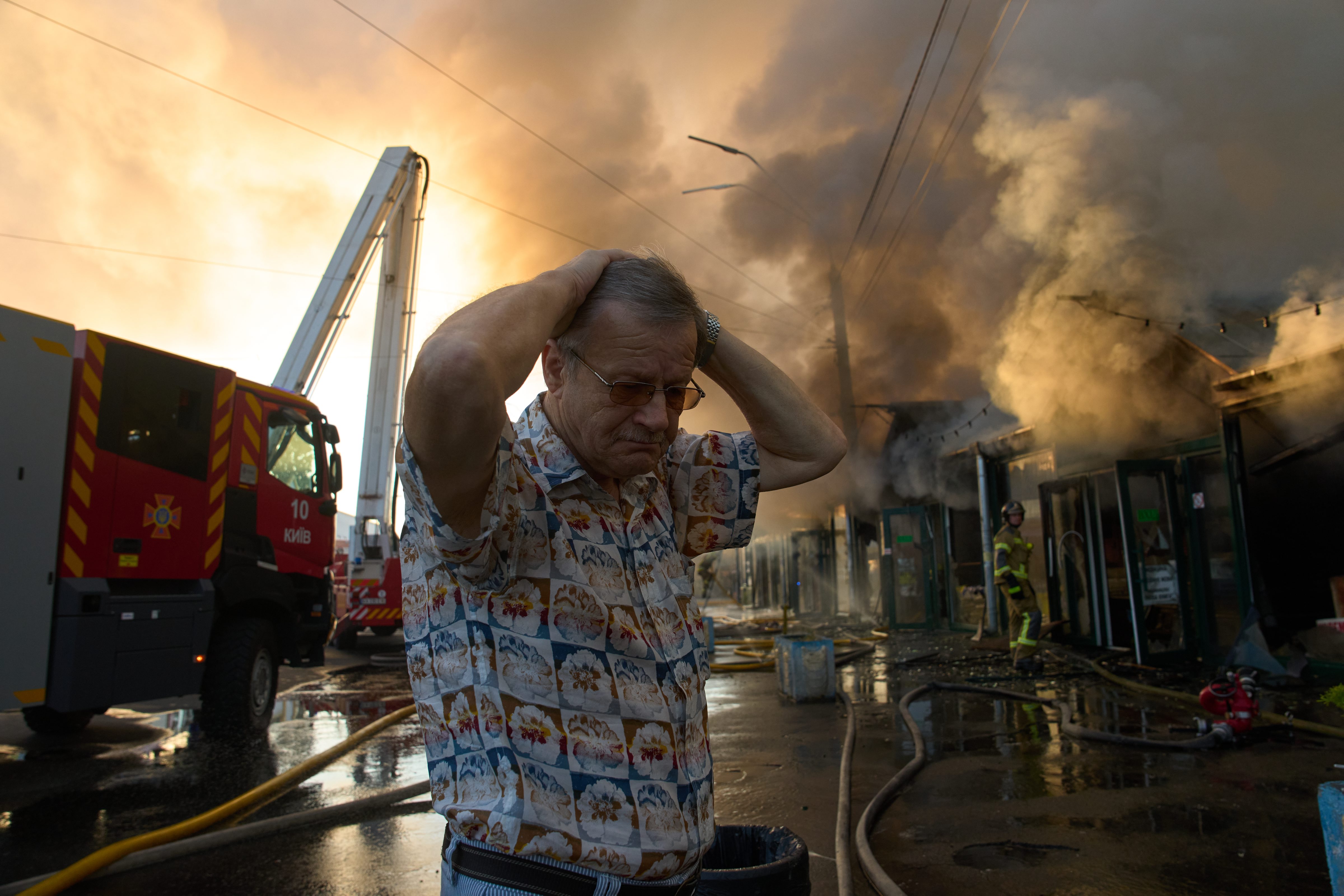 A person expressing concern after seeing the fire that broke out in Kiev's book market after Russia's missile attack.