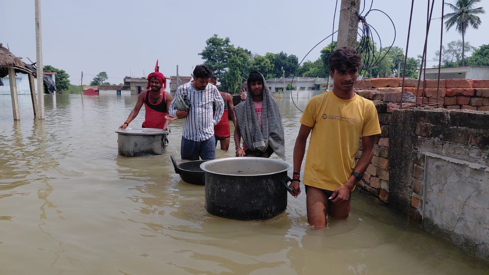 People arranging food amidst floods in Khagaria, Bihar.