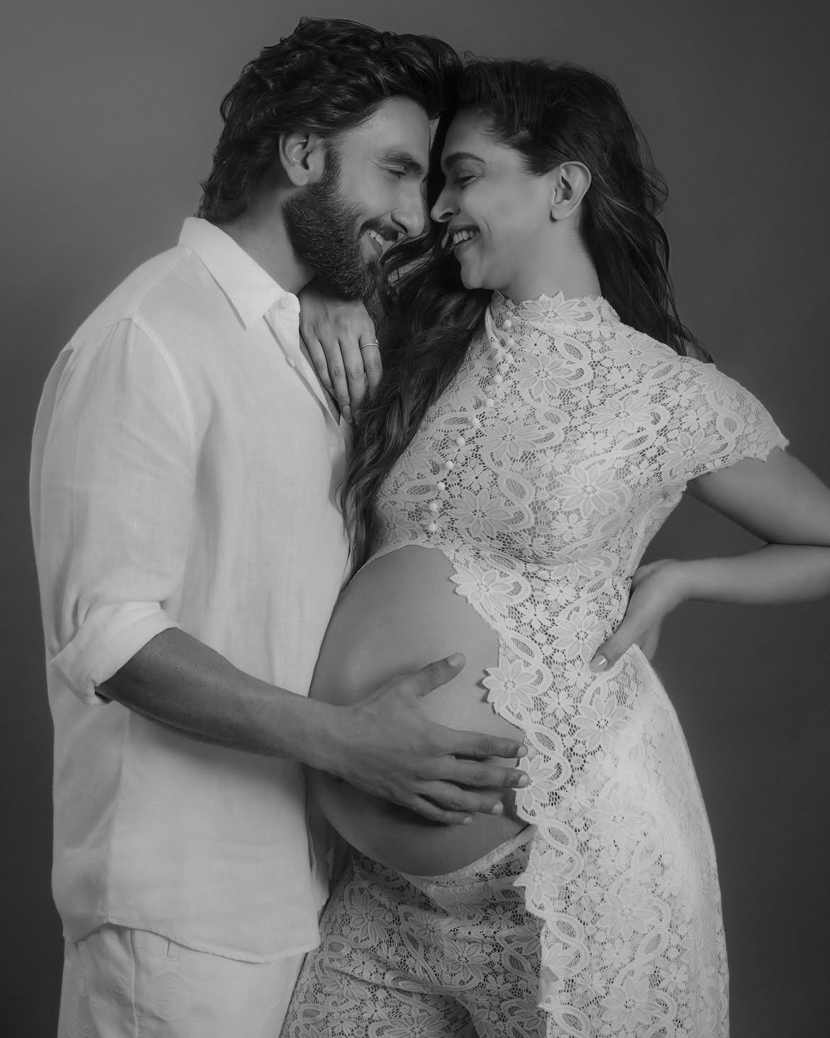 The couple had a photoshoot done in white clothes with a black and white theme.