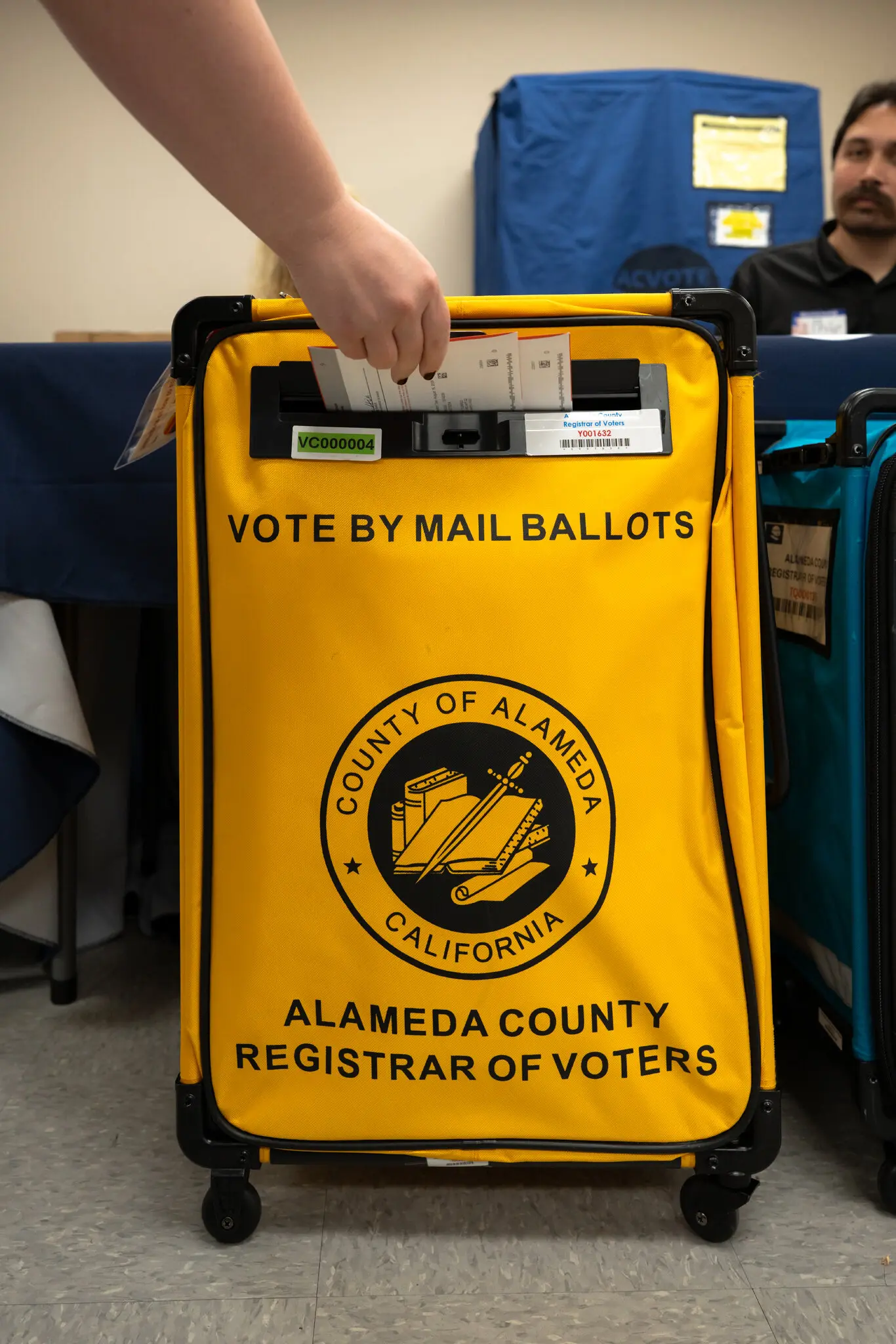 A voter submitting his mail ballot in Livermore, California, USA. (Photo-NYT)