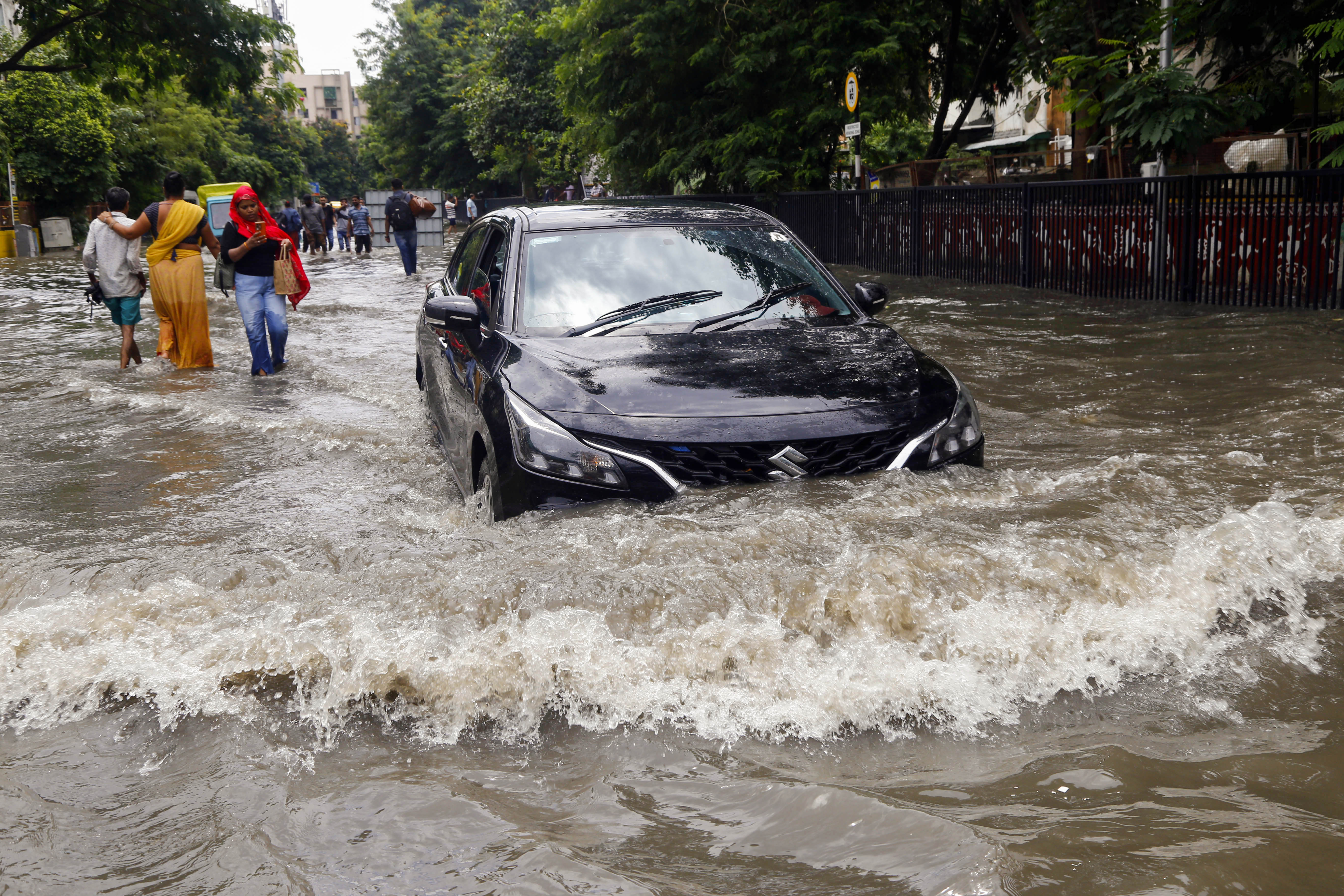 Roads were waterlogged after heavy rain in Ahmedabad, Gujarat. Vehicles were seen passing through 2 feet of water.