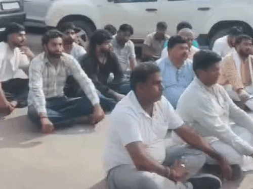 Congress leaders staging a sit-in outside the Pinjore police station.