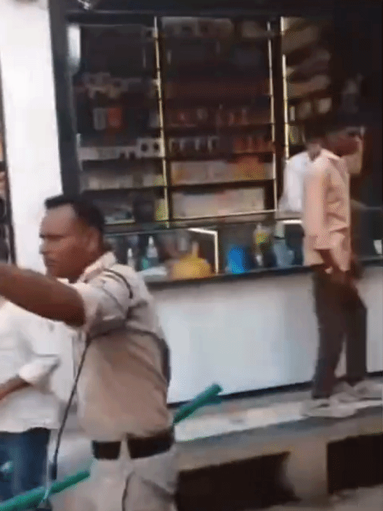 Police personnel forcibly dispersed the crowd and caught the young man.