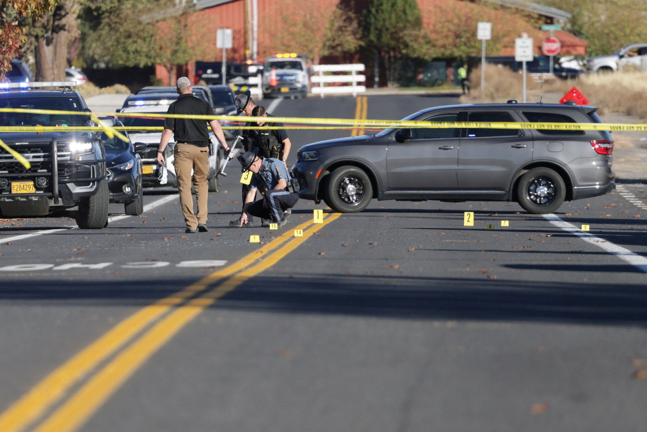 Policemen investigating at the scene after the firing.
