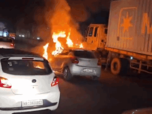 View of burning car near Bilaspur on Delhi-Jaipur NH-48.