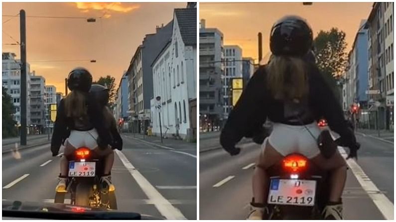 As soon as the red light came on the couple sat on the bike and did a romantic dance, people were stunned | રેડ લાઇટ થતાં જ કપલે બાઇક પર બેઠાં બેઠાં કર્યો રોમેન્ટિક ડાન્સ, લોકો સ્તબ્ધ થઈ ગયા - Vimarsana News