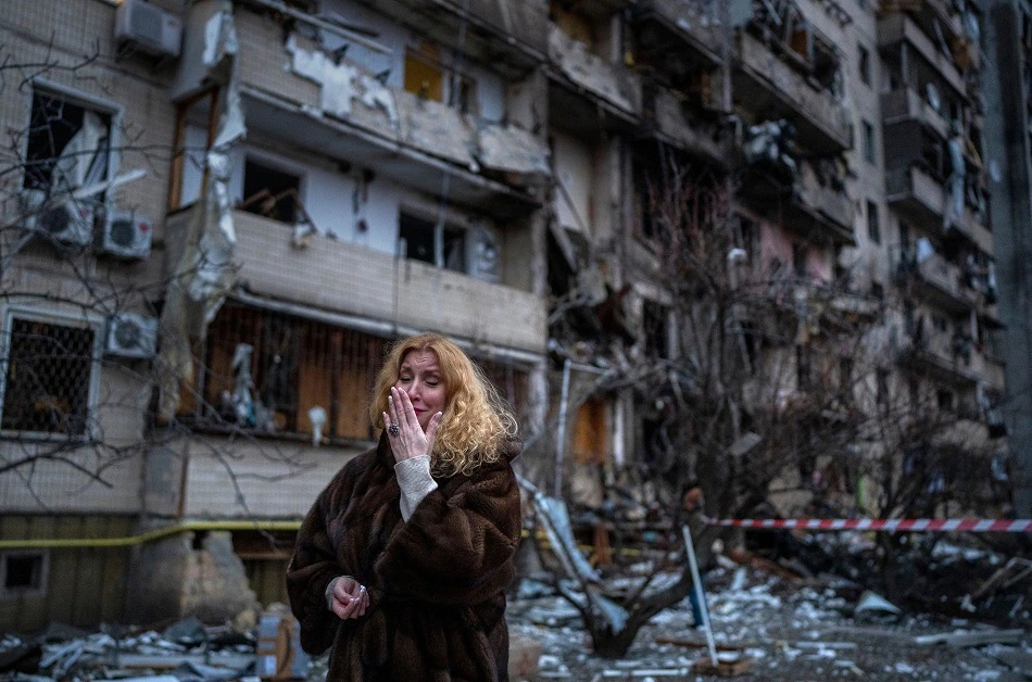 A woman cries out in fear of Russia's invasion of Ukraine.