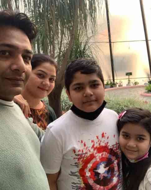 Hemant to his wife with two children.