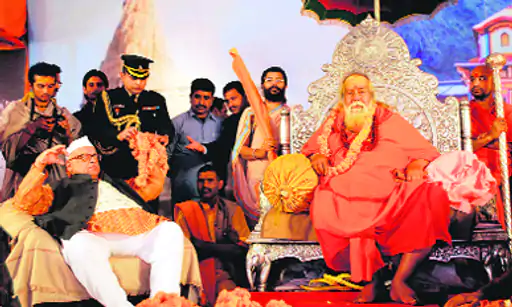 Photo is from February 2013.  Uttarakhand Governor Aziz Qureshi was felicitated by religious leaders for upholding the sanctity of the Ganga and Yamuna at the Allahabad Mahakumbh.  Governor Jagatguru Shankaracharya Swami Swarupananda Saraswatiji was the chief guest on the occasion.