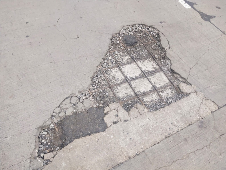 Potholes where rods are visible everywhere on Pramukhswamy Bridge, ex ...